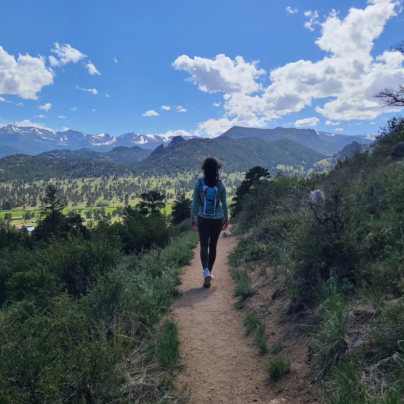 Ajna walking away up a mountain path